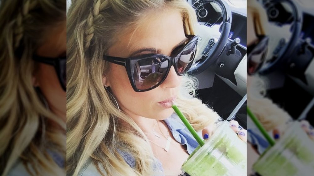 Christina Anstead drinking a green smoothie