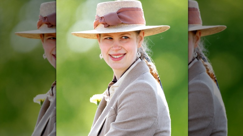 Lady Louise smiling over her shoulder