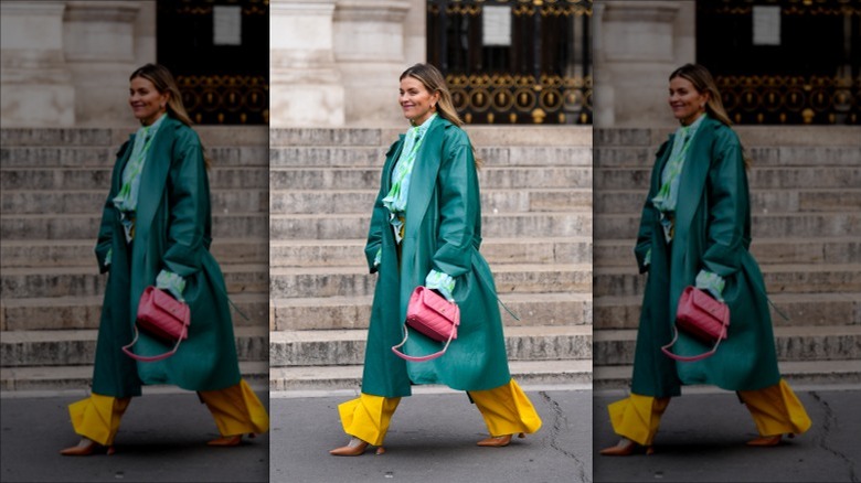 Woman walking along street