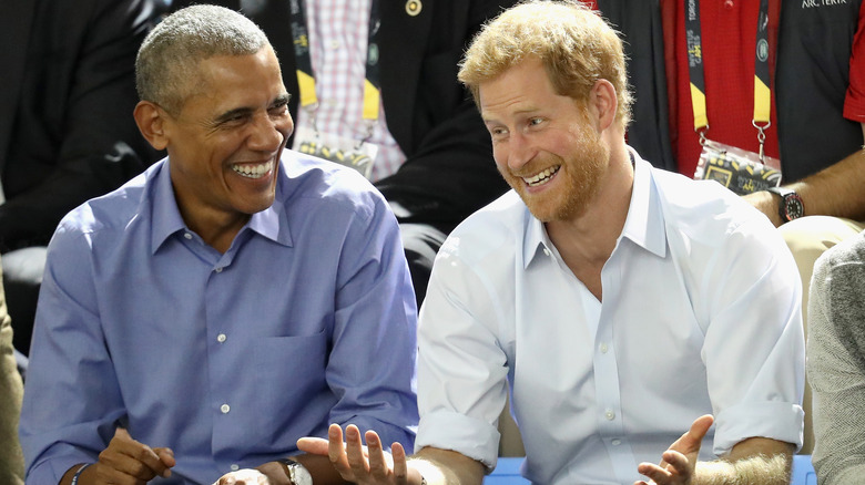 Barack Obama and Prince Harry laughing 