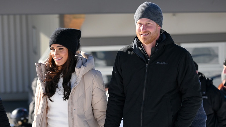 Prince Harry and Meghan Markle walking in snow 