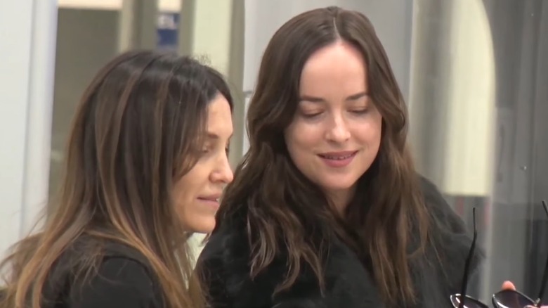 Dakota Johnson without makeup at airport security