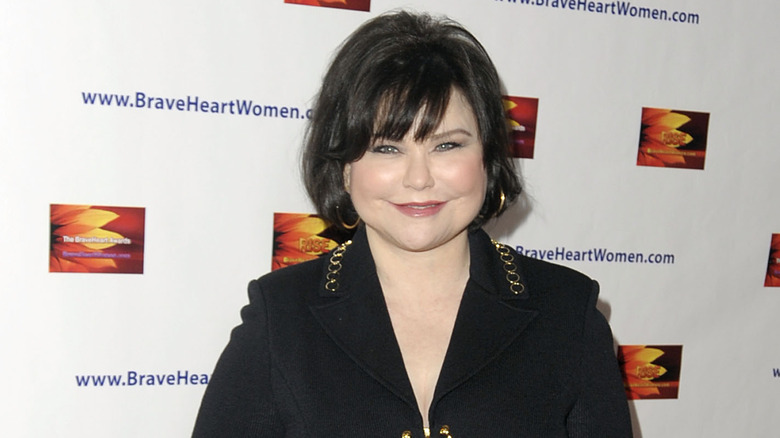 Delta Burke smiling, posing