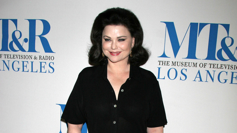 Delta Burke smiling, posing