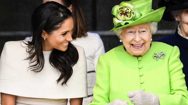 Meghan talking to Queen Elizabeth II