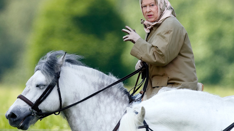 Queen Elizabeth II riding a horse