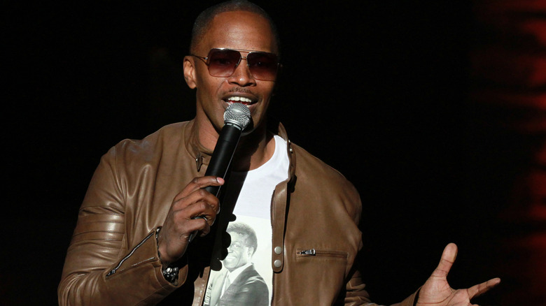 Jamie Foxx on stage telling jokes