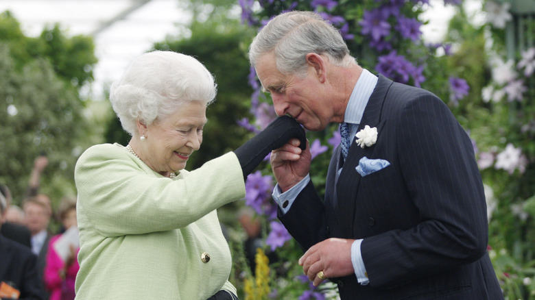 Charles kissing the queen's hand 