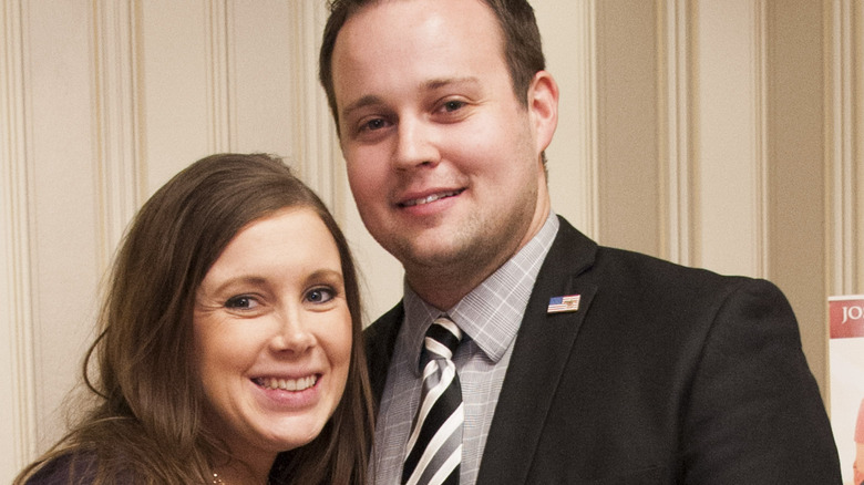 Anna and Josh Duggar smiling at an event