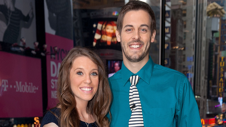 Jill Duggar and Derick Dillard smiling at an event