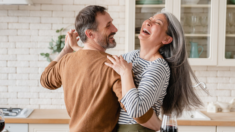 couple dancing in kitchen 