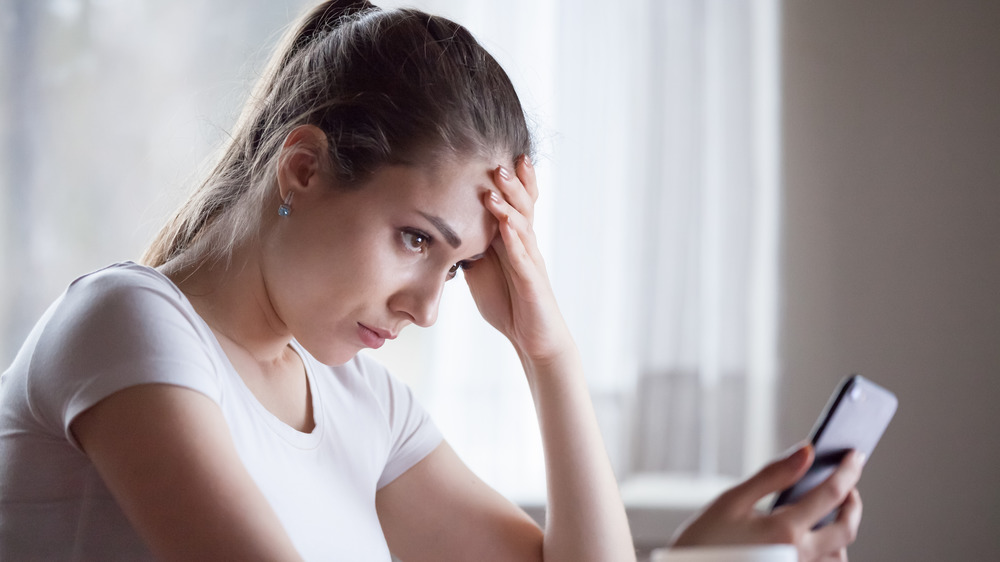 Stressed out woman and phone 