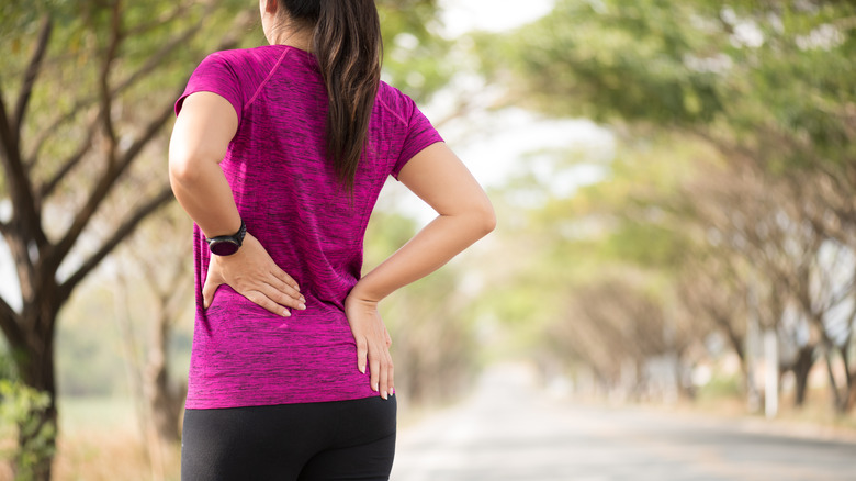 Female runner with back and hip pain