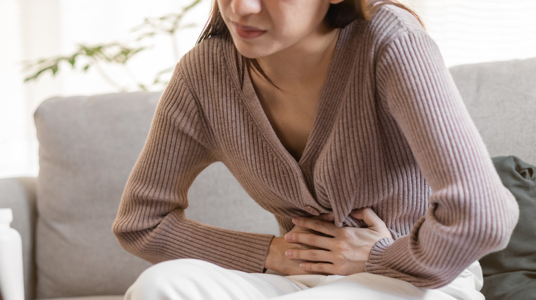 Woman having stomach cramping