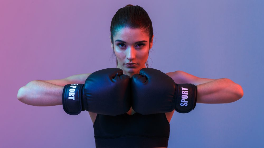 Woman wearing boxing gloves