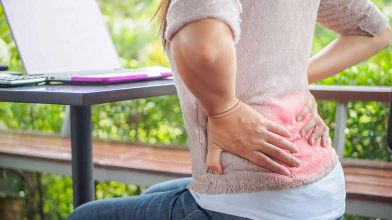 Woman experiencing pain in her hip