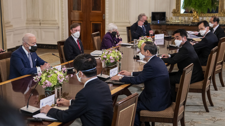 President Joe Biden with Japan's Prime minister wearing masks