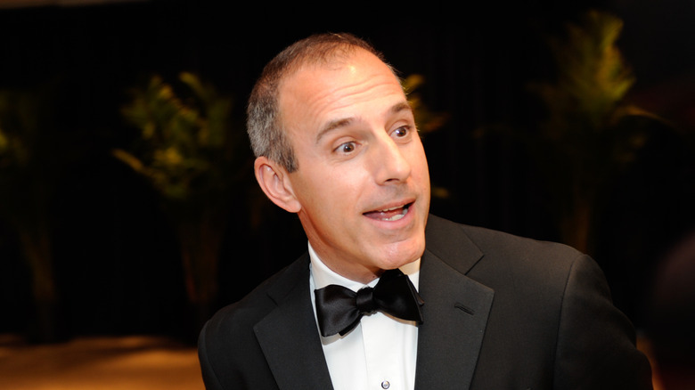 Matt Lauer smiles to the side in black tuxedo