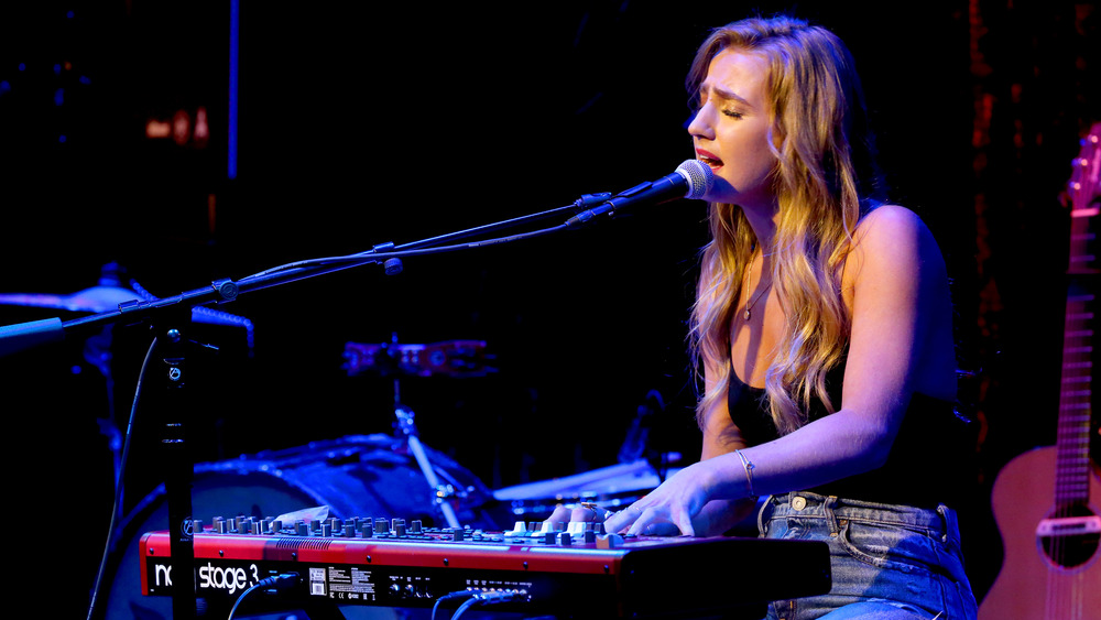 Ingrid Andress singing and playing keyboard