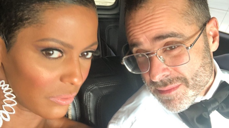 Tamron Hall and Steven Greener taking a selfie in a car