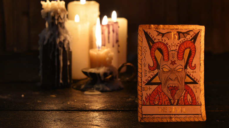 Devil tarot card with candles