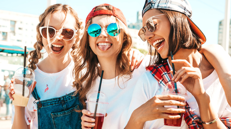 Women sunglasses iced drinks beach