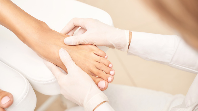 Foot getting a massage at a spa