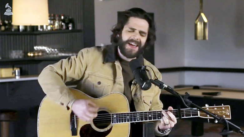 Thomas Rhett singing, playing a guitar