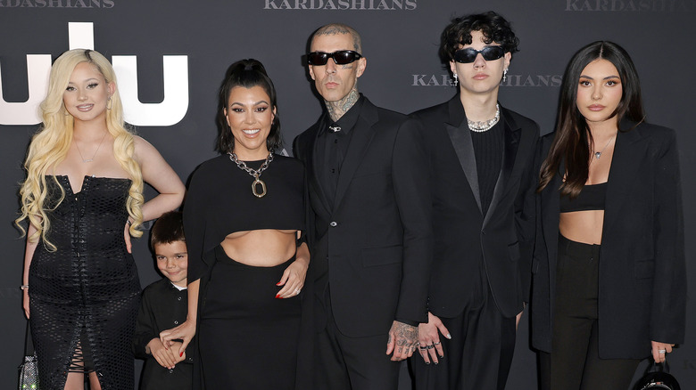 Travis Barker poses with his children and Kourtney Karadashian