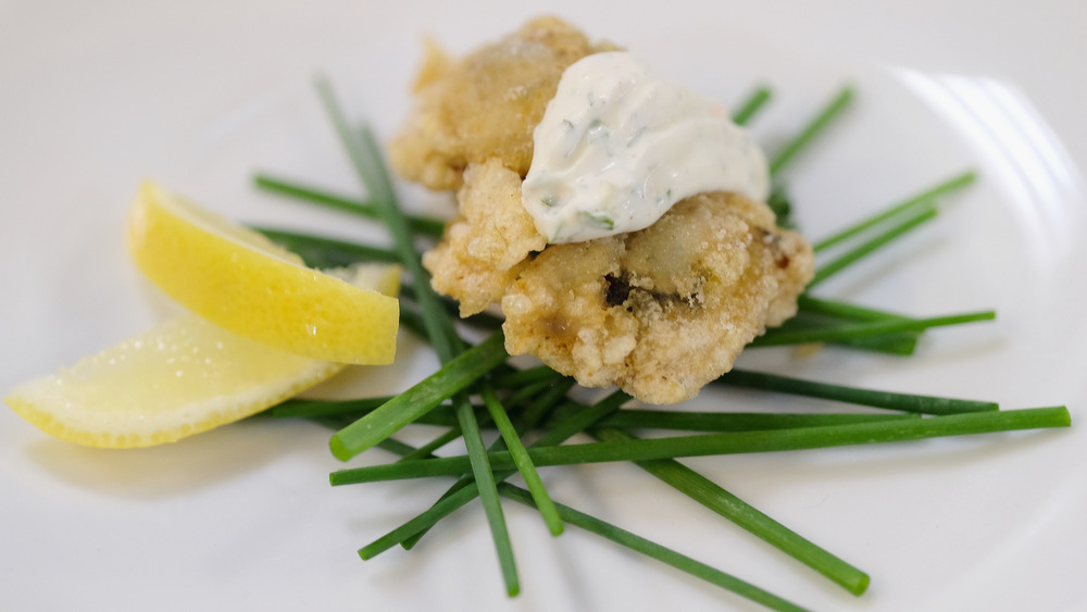 Fried oysters with lemon, herbs