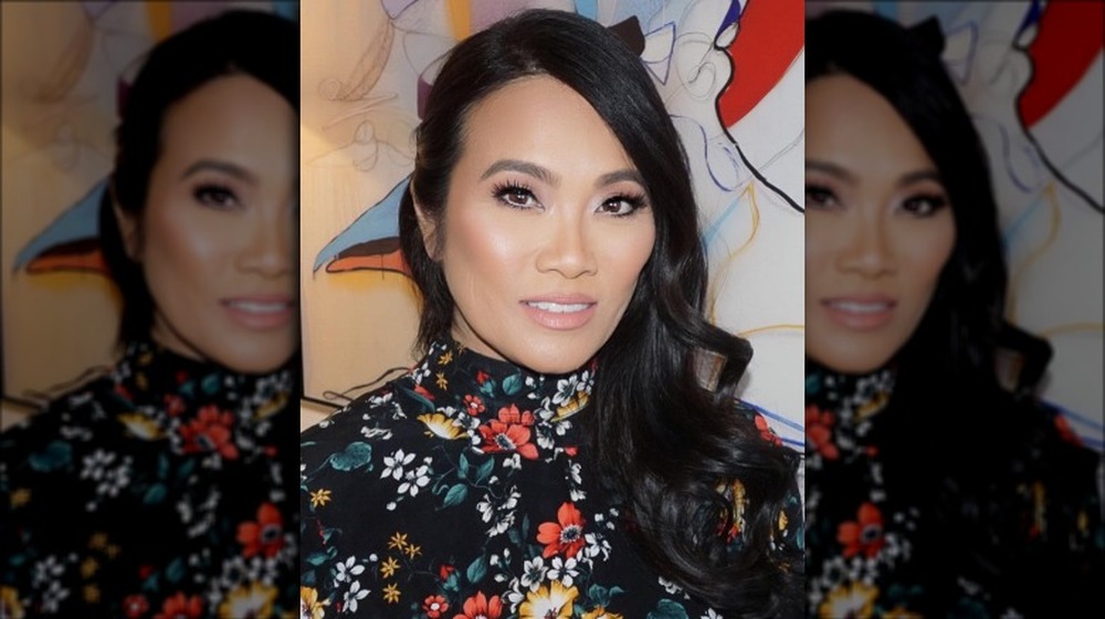 Dr. Pimple Popper in a floral-print shirt