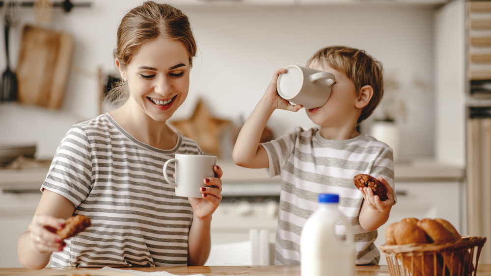 Family eating milk and cookies