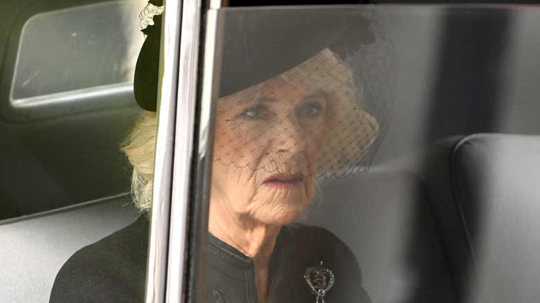 Queen Camilla in car in funeral attire 