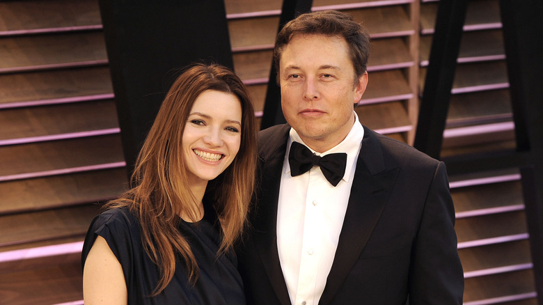 Talulah Riley and Elon Musk posing for photos in their finery