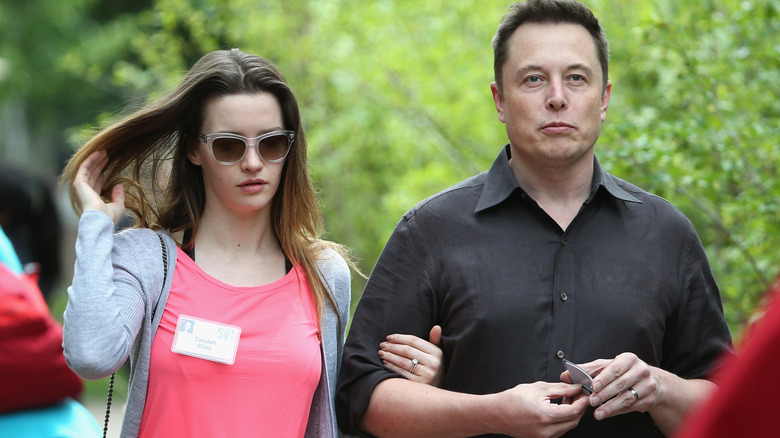 Talulah Riley and Elon Musk walking