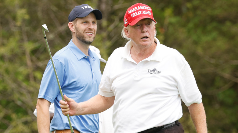 Eric Trump and Donald Trump golfing