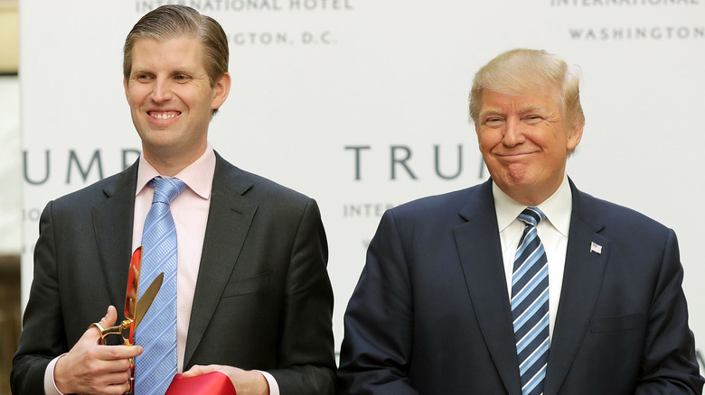 Eric Trump and Donald Trump cutting ribbon 