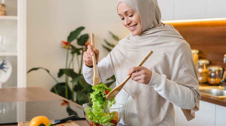 woman making a salad