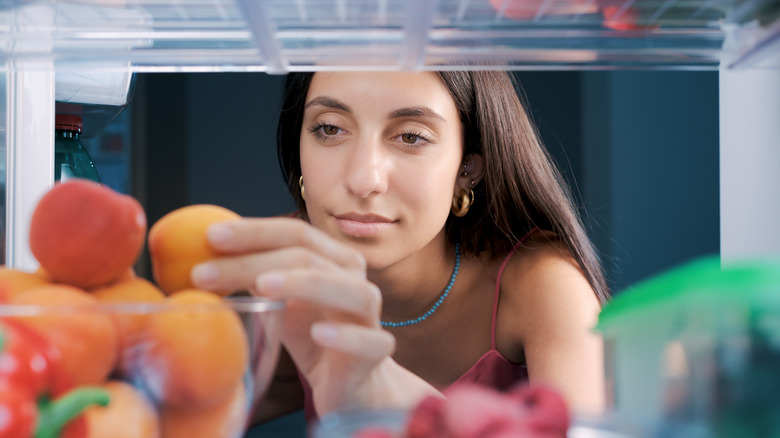 woman selecting fruit