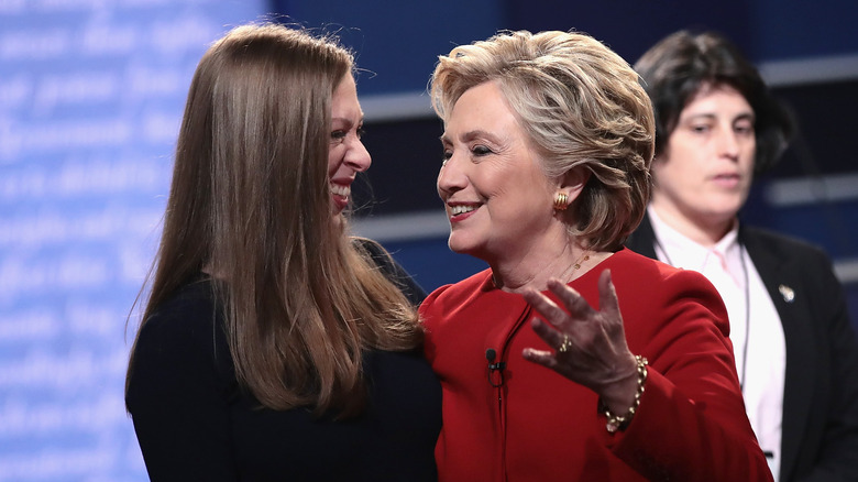 Chelsea Clinton smiles at Hillary Clinton