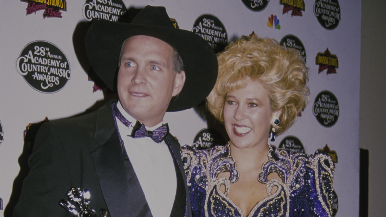 Garth Brooks posing with his ex-wife, Sandy Mahl, at the 28th Annual ACM Awards