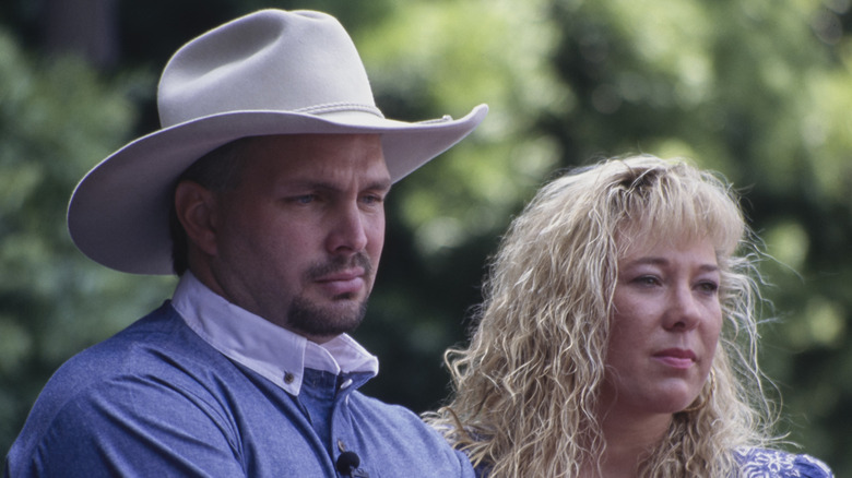 Sandy Mahl standing with Garth Brooks outdoors