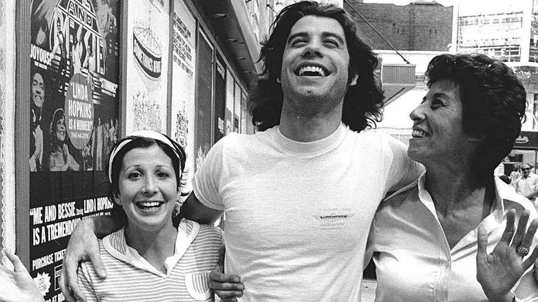 Ann, John, and Ellen Travolta in 1976 smiling