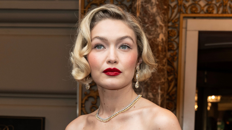 Gigi Hadid posing in red lipstick