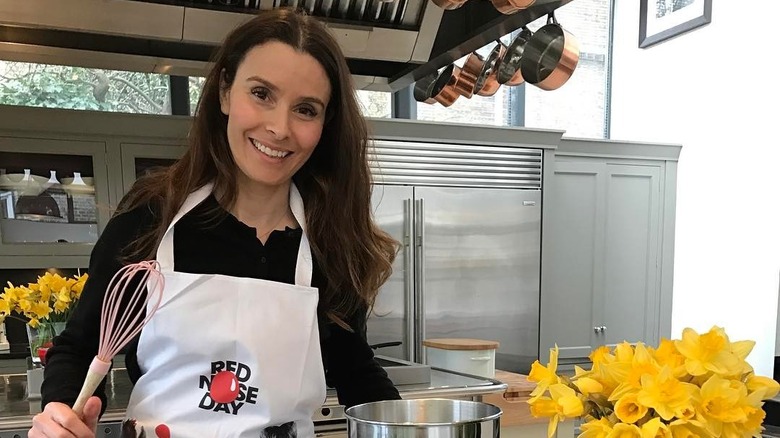 Tana Ramsey cooking in kitchen