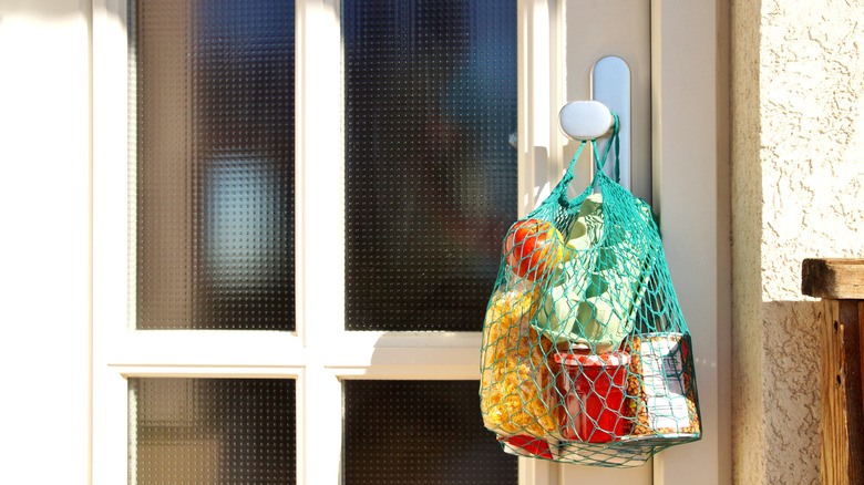 groceries hanging on door knob