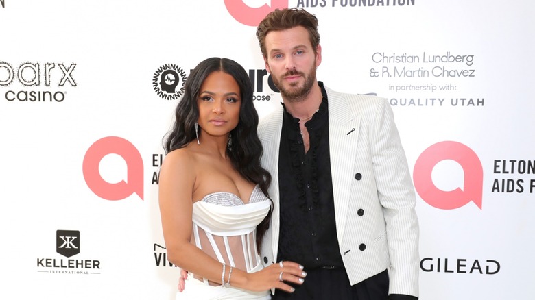 Christina Milian on a red carpet with Matt Pokora