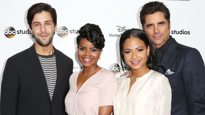 Josh Peck, Kelly Jenrette, Christina Milian, and John Stamos on a red carpet together