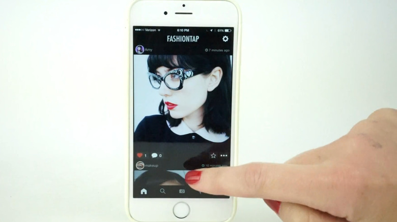 Person scrolling through FashionTap app