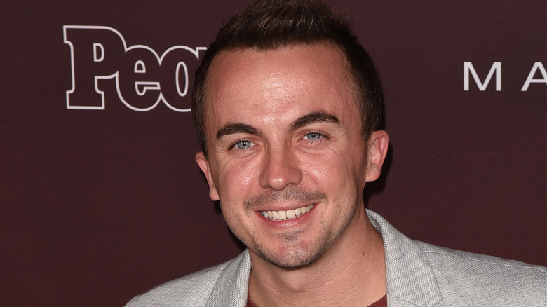 Frankie Muniz smiling at event